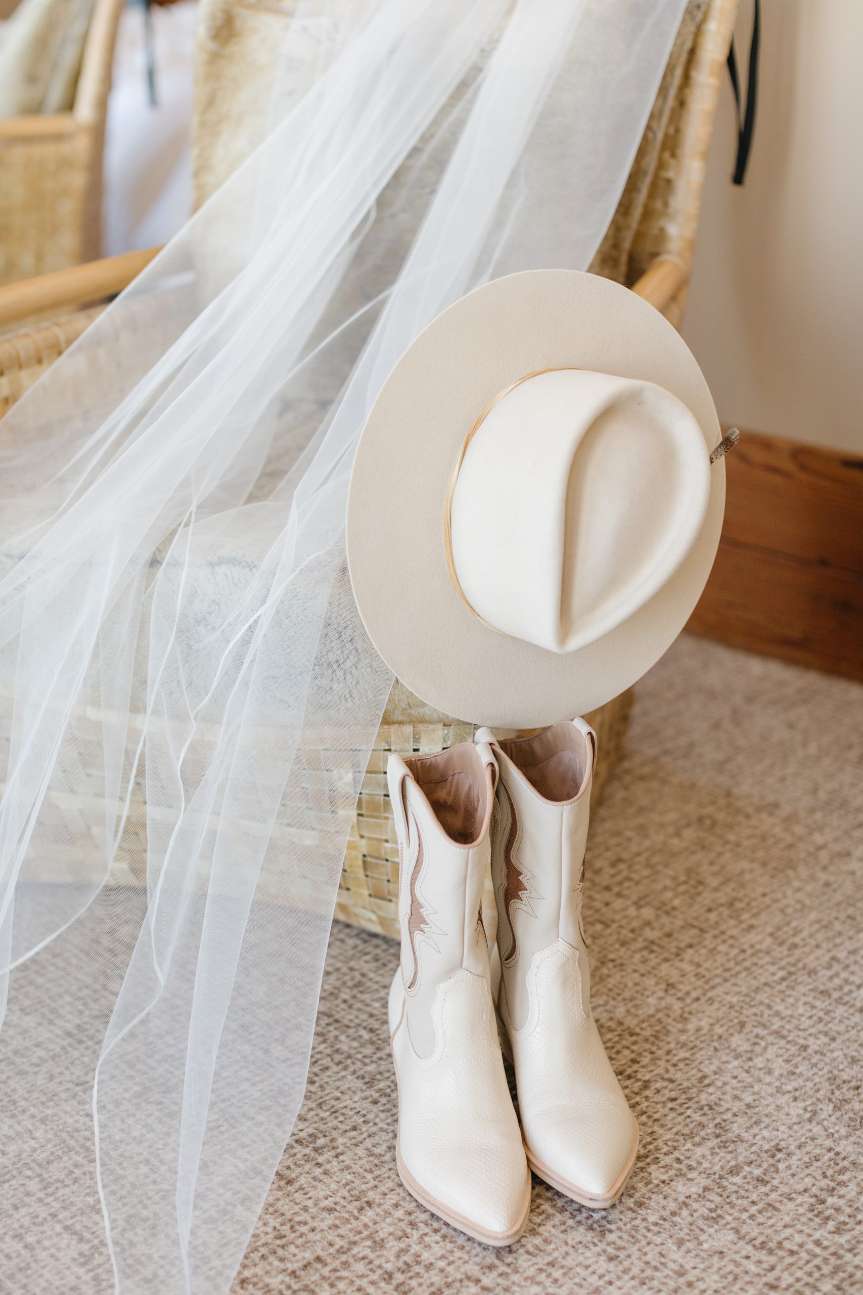 cowgirls shoes, cowgirl hat, and veil.