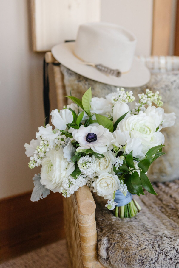 cowboy hat and bouquet at the best ranch wedding venue in wyoming