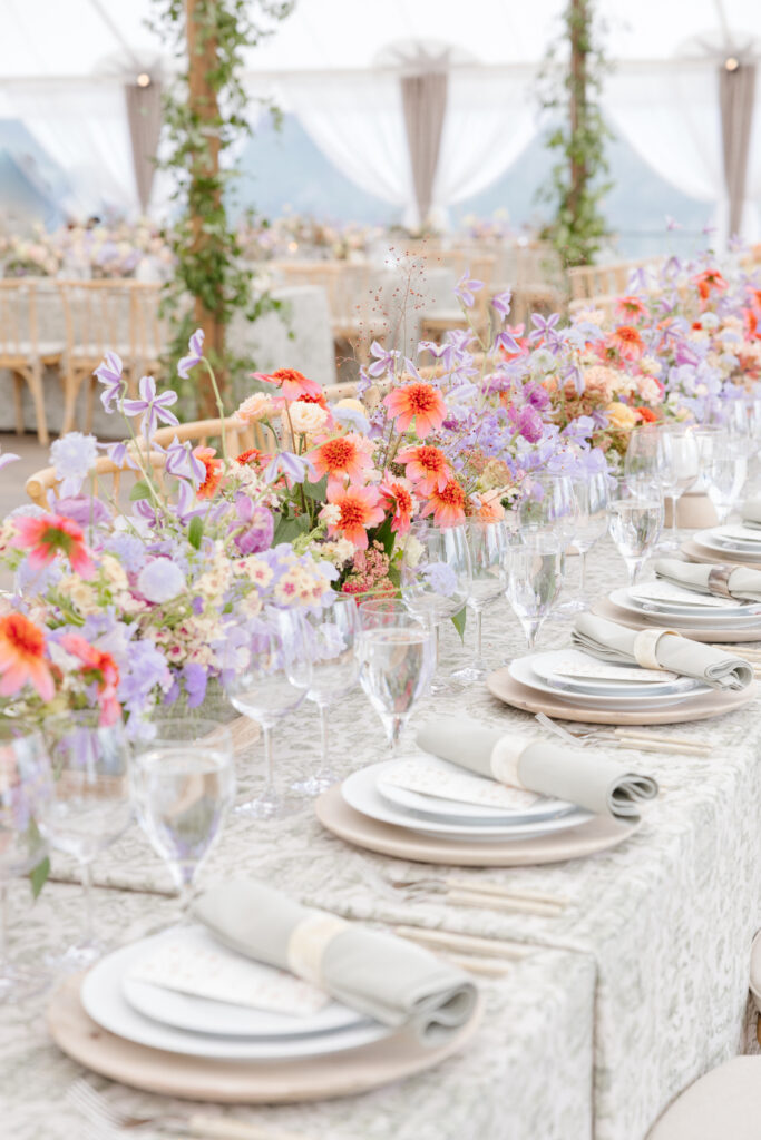 Elegant reception table with colorful flowers. 