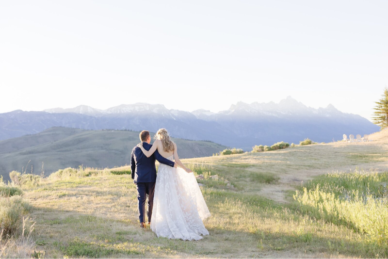 couple overlooking the scenery on their wedding day at jackson hole