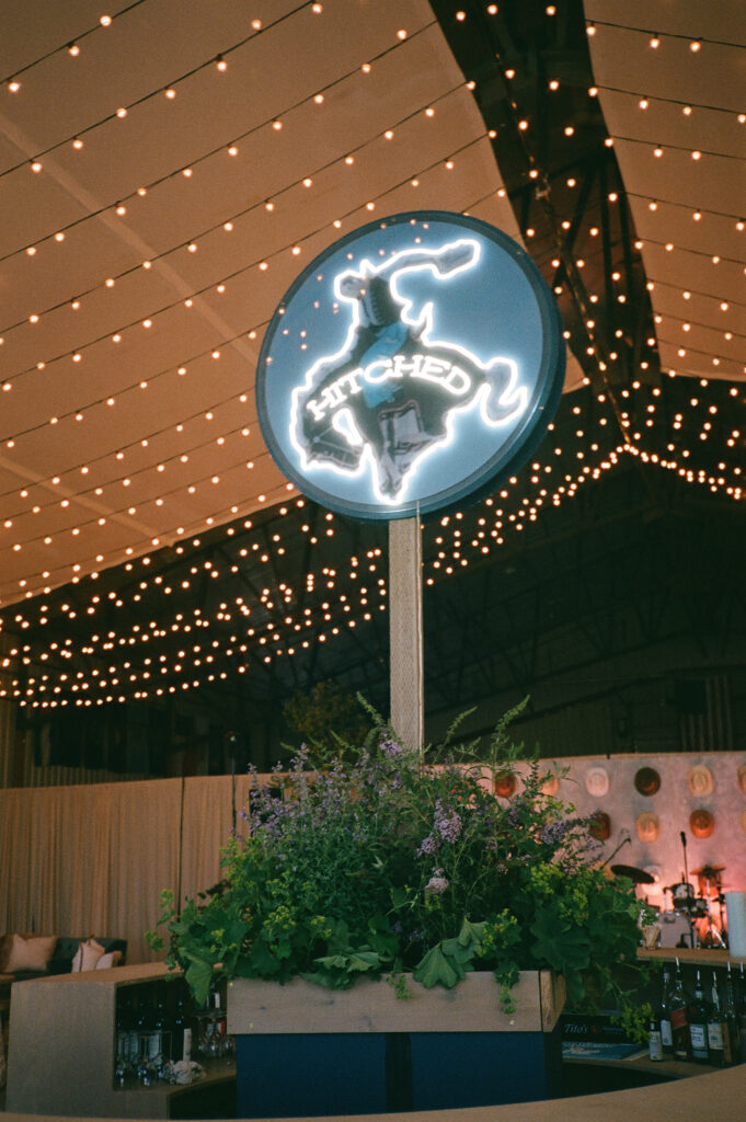 hitched sign in the reception barn at Diamond Cross Ranch