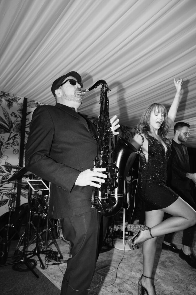 Live band brings the energy at Jackson Hole Golf and Tennis Club—an unforgettable wedding celebration moment.