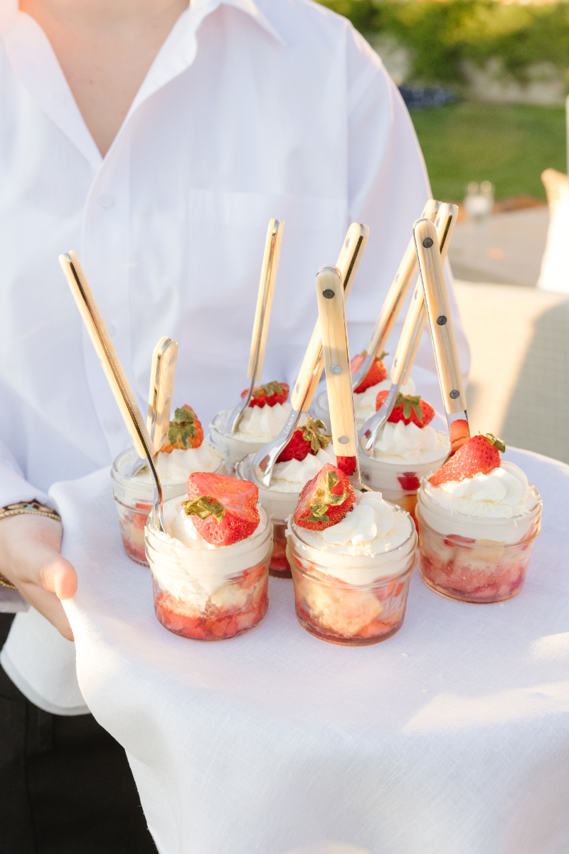 Server passes parfait at destination wedding in Jackson Hole.