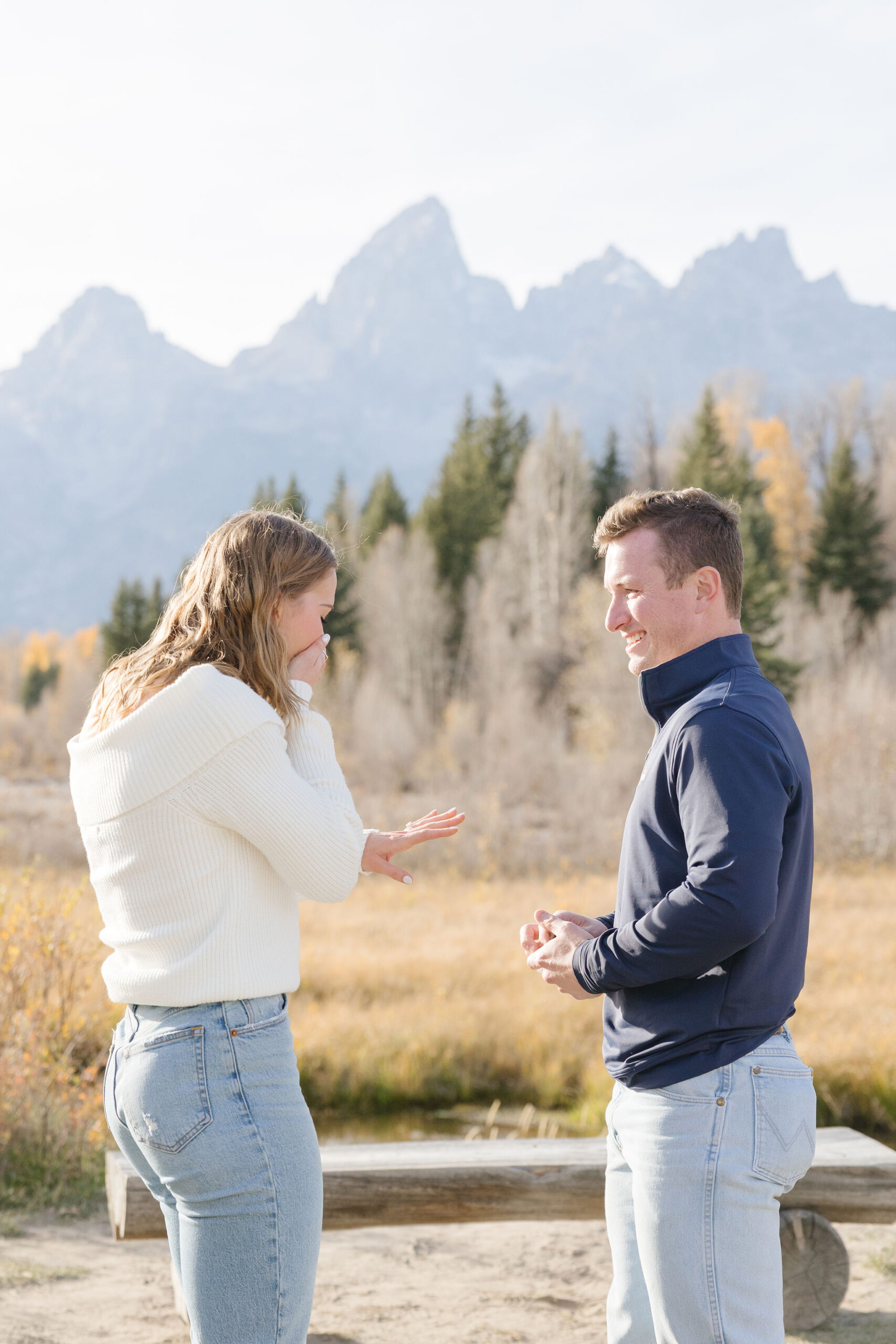 Surprise proposal photographer in Jackson Hole and Grand Tetons captures proposal at Schwabacher Landing.