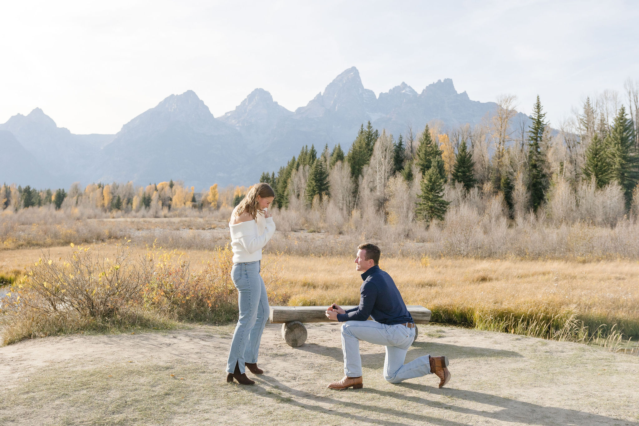 Surprise proposal photographer in Jackson Hole and Grand Tetons captures proposal at Schwabacher Landing.
