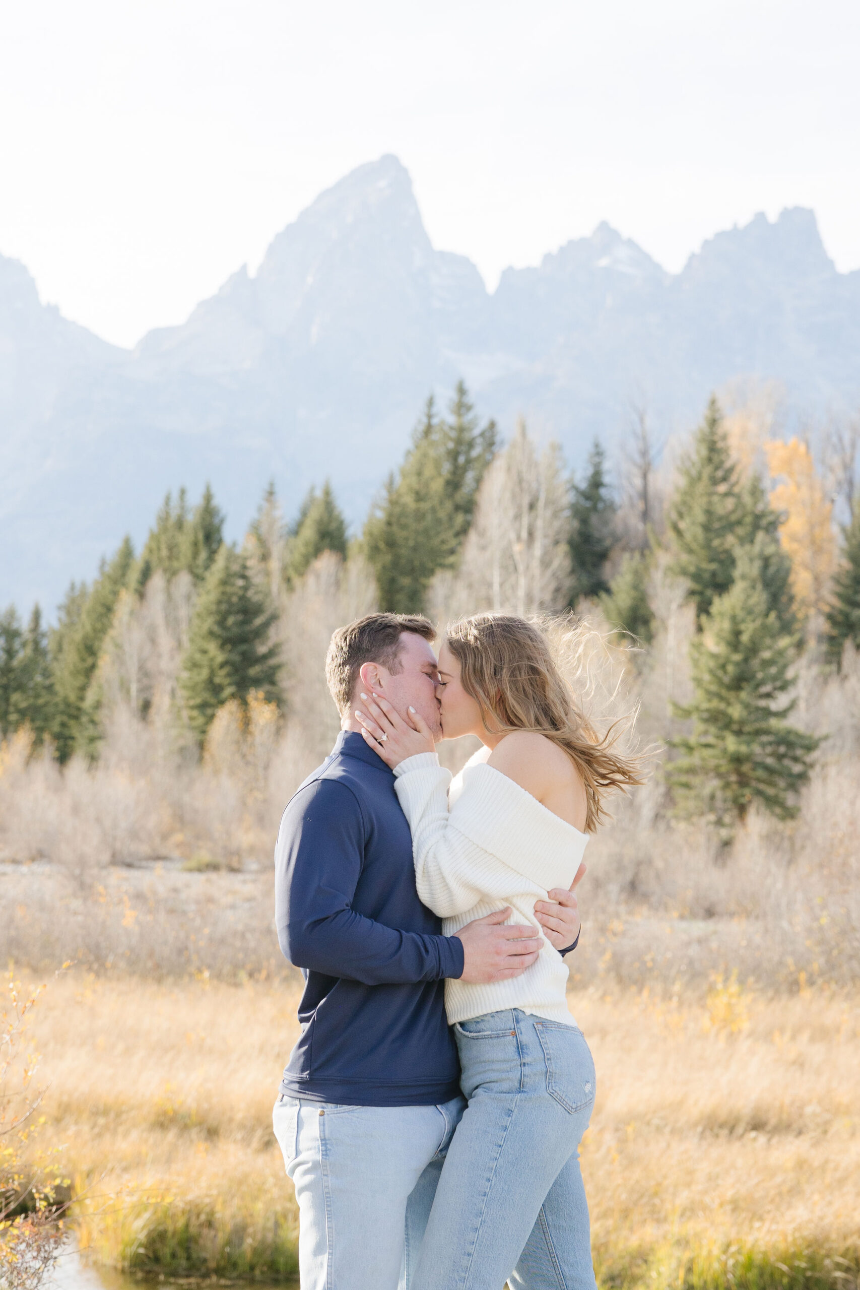 Surprise proposal photographer in Jackson Hole and Grand Tetons captures proposal at Schwabacher Landing.