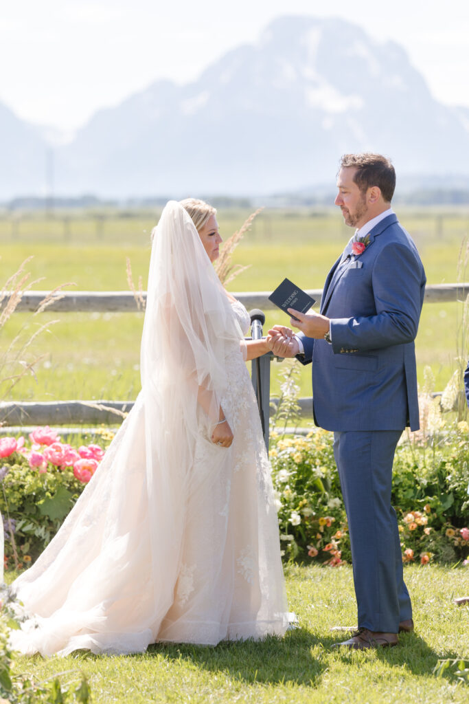 Bride and groom exchange vows in one of the best places to elope, Grant Teton National Park.