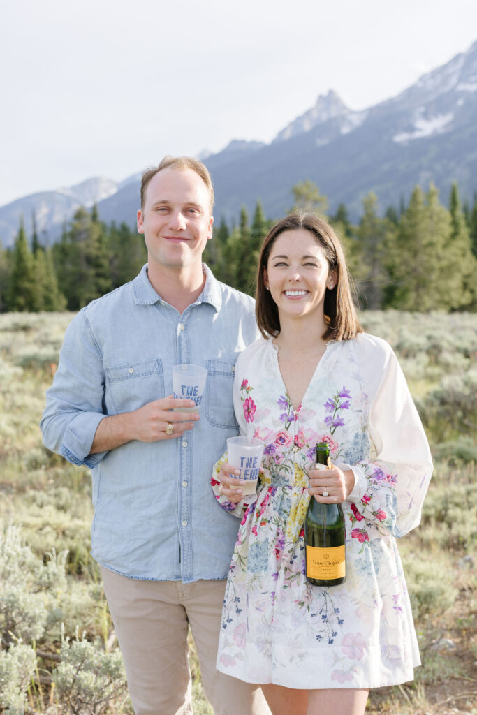 Couple share bottle of champagne in GTNP