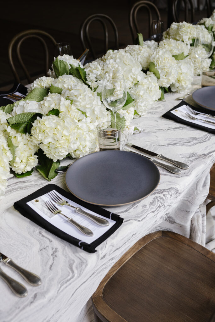 Black and white tablescape details at indoor reception venues in Jackson Hole and Grand Teton.