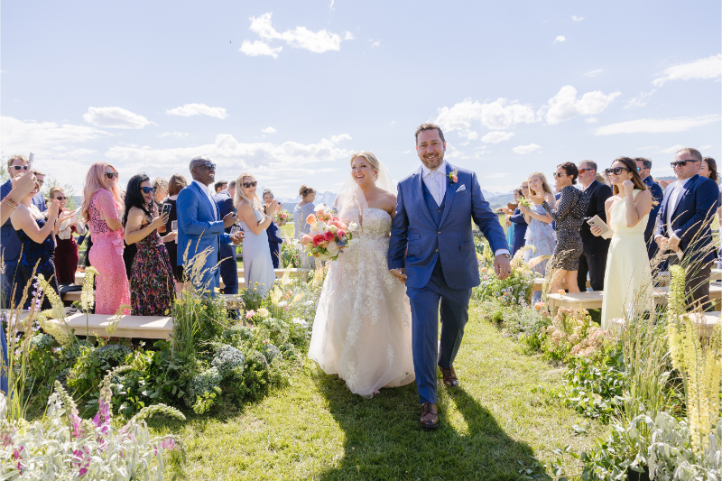 Photographer captures couple exiting the aisle after their Wyoming elopement.
