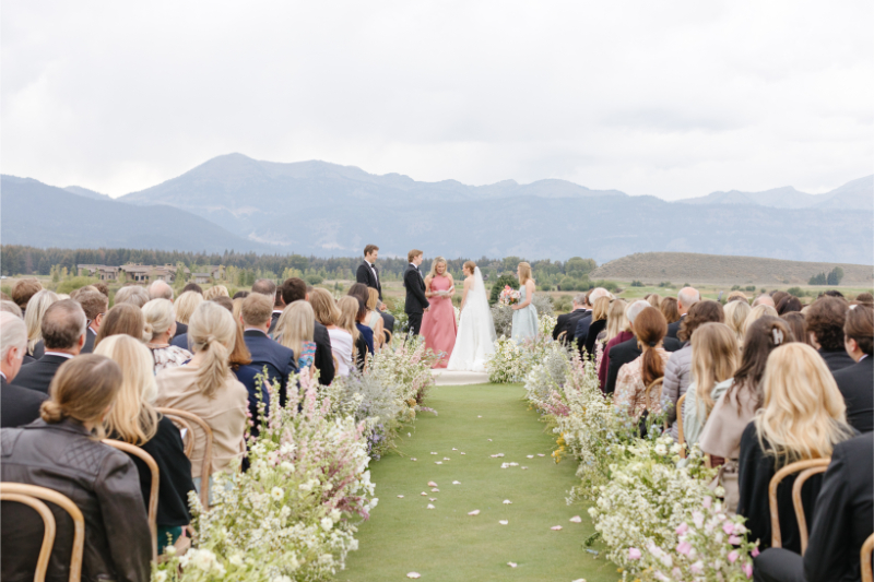 Bride and groom exchange vows in one of the most beautiful Wyoming wedding locations.