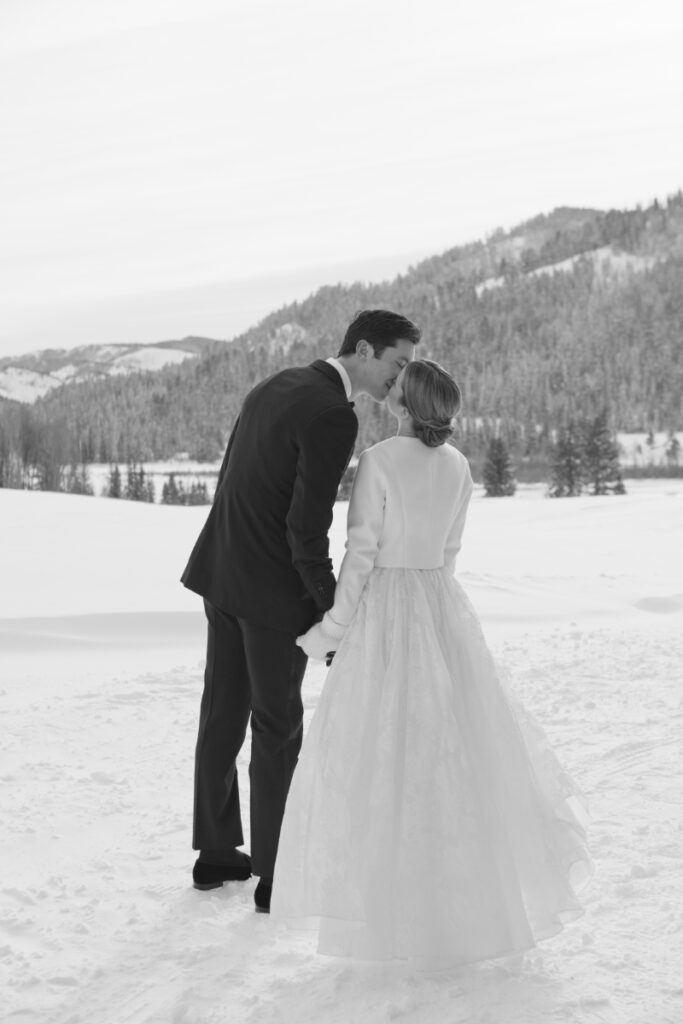 Bride and groom take portraits in one of the most beautiful Wyoming wedding locations.