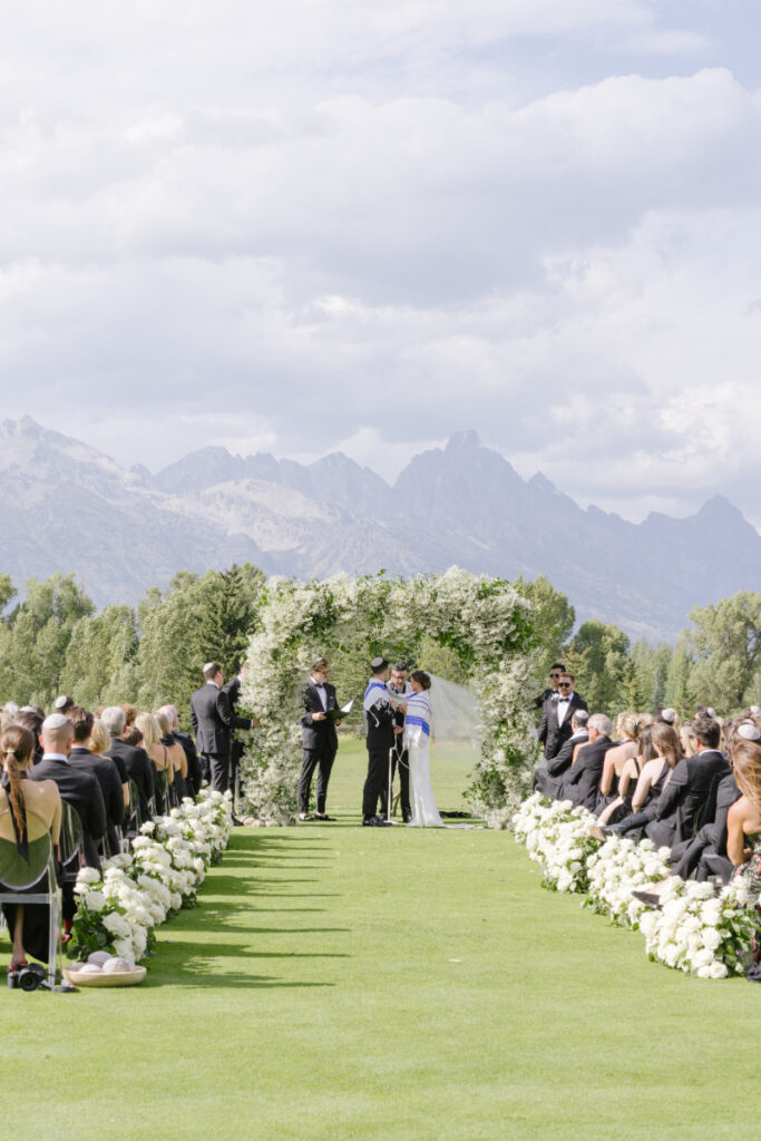 Photographer captures wedding ceremony, after couple chose between an elopement vs. wedding.