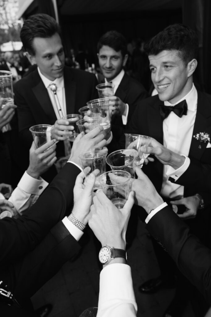 Groom shares toast with his closest friends.