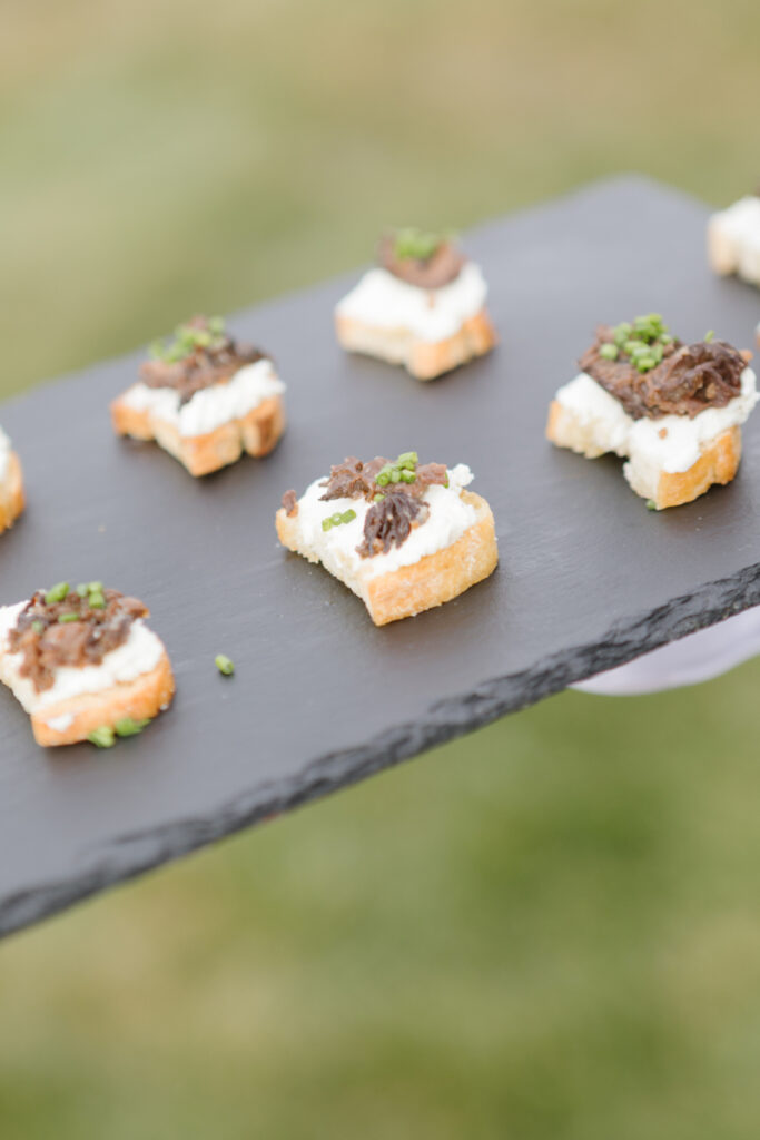 Passed appetizers on a chalk platter.