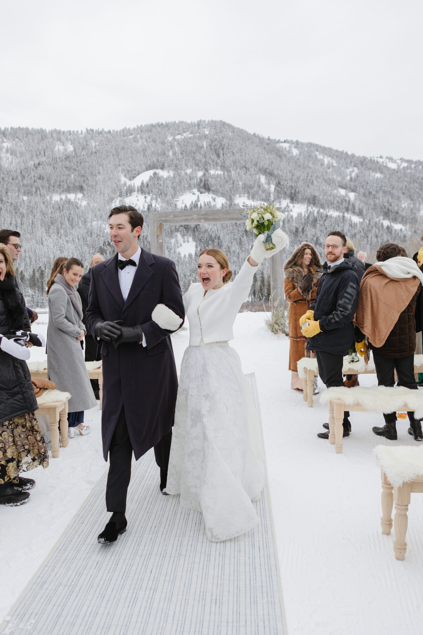 Bride and groom recess after exchanging vows during their winter Jackson Hole weddings.