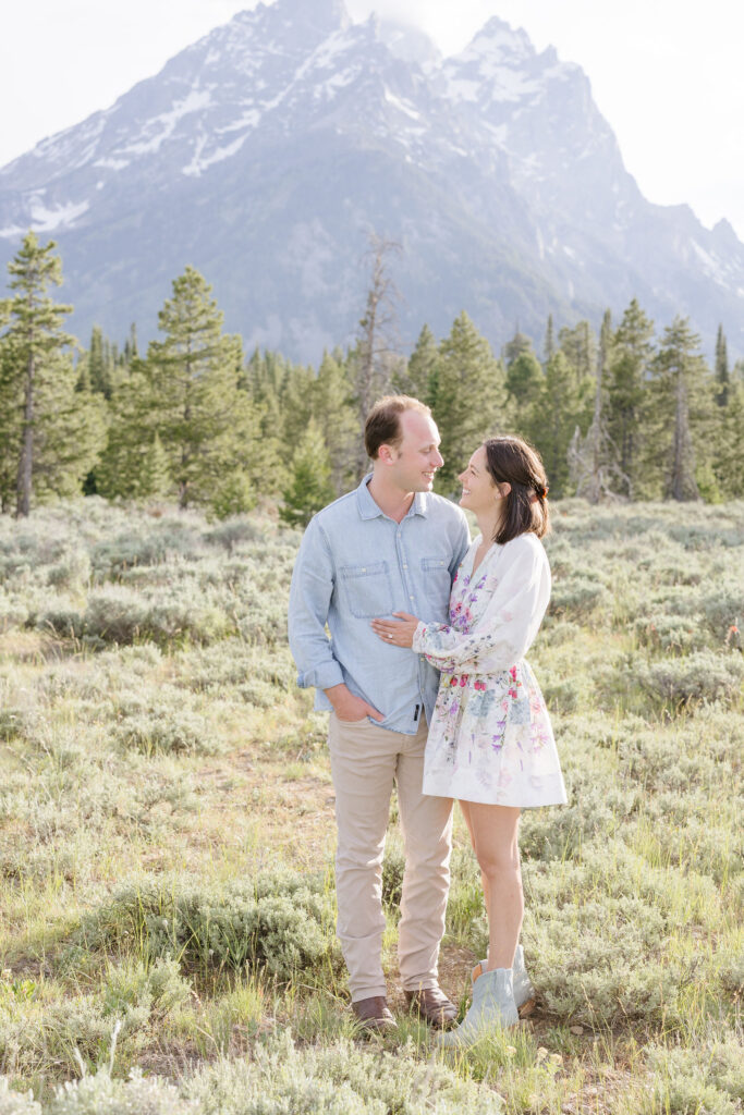 couple hugging and looking at each other eyes for their engagement photography at Jackson Hole.