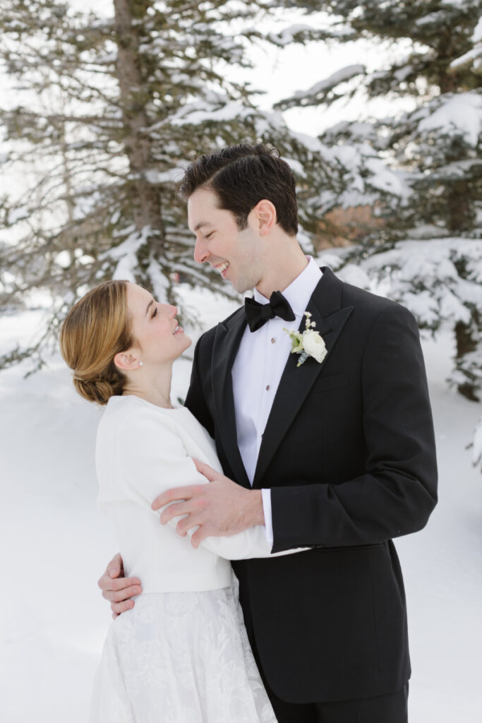 Bride and Groom taking intimate wedding picture in the winter.