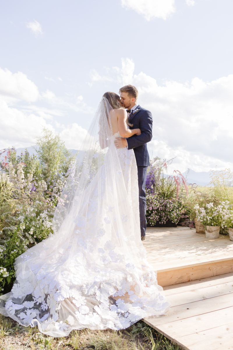 A Yellowstone National Park wedding. The Bride and Groom kissing.