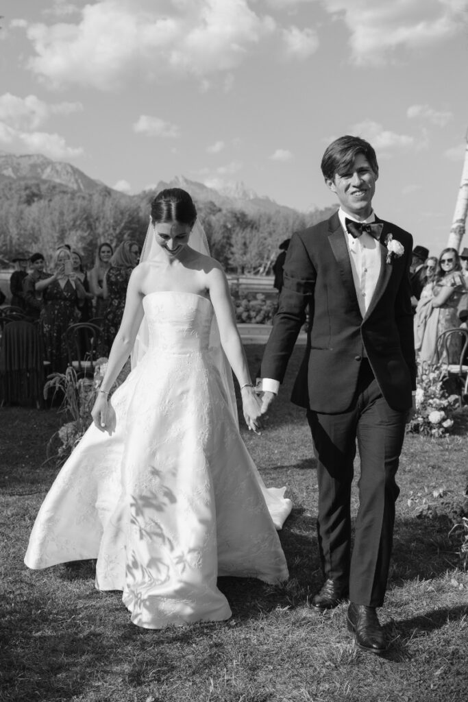 Newlyweds walking down the aisle after ceremony in Jackson Hole, photographed by Jackson Hole Photographers