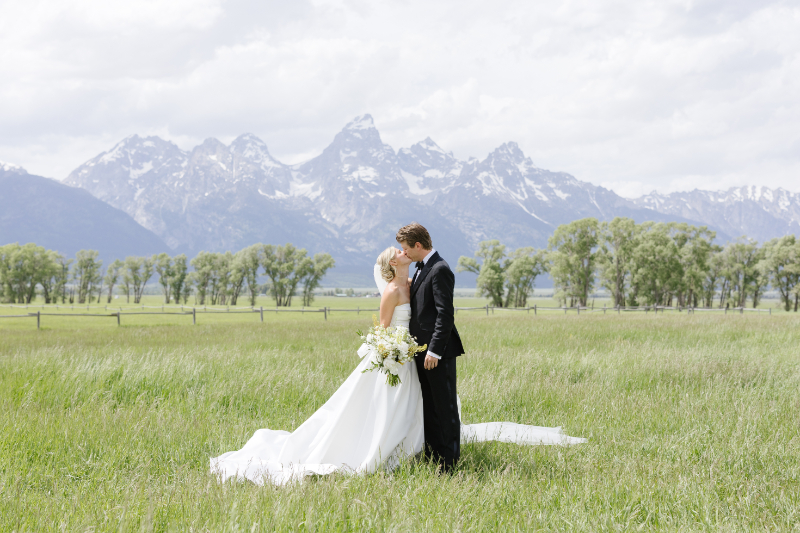 Bride and Groom kissing and having a mountain elopement wedding.