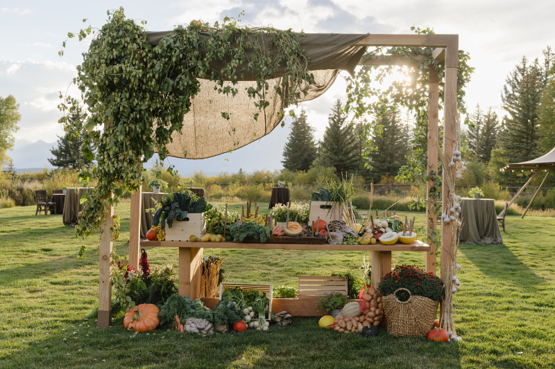 Rustic welcome display with fresh produce at a Jackson Hole dude ranch wedding