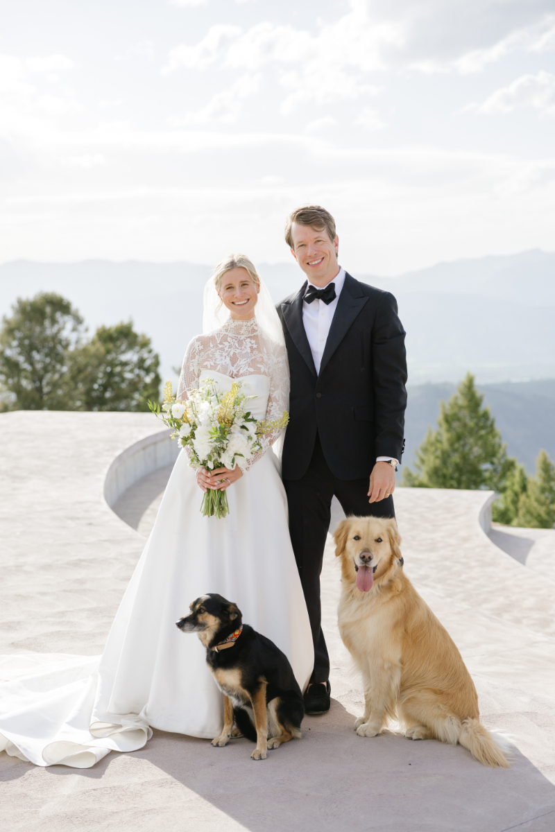 Bride and groom posing with their dogs at a wedding in Jackson Hole