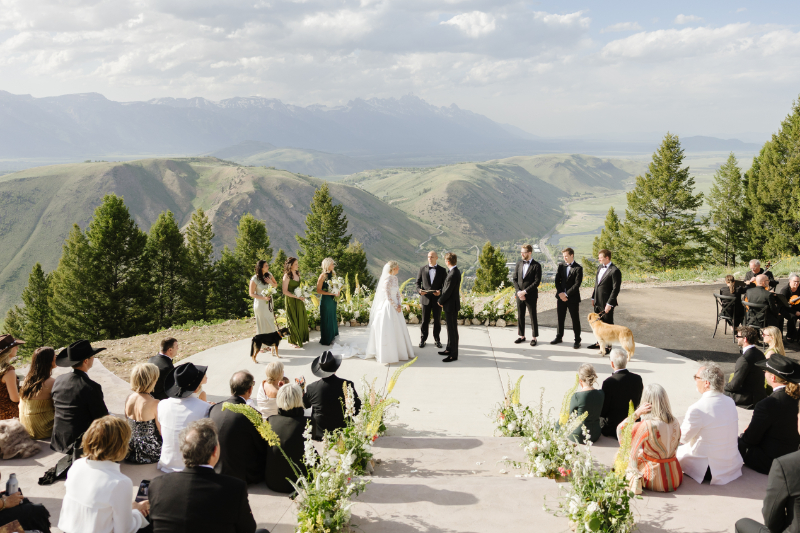 Guests seated for a mountaintop ceremony at a Snow King Mountain wedding with panoramic views