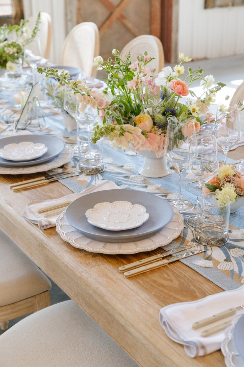 Elegant Western wedding reception table with soft blue linens, pastel florals, and refined ranch-inspired details in Jackson Hole.