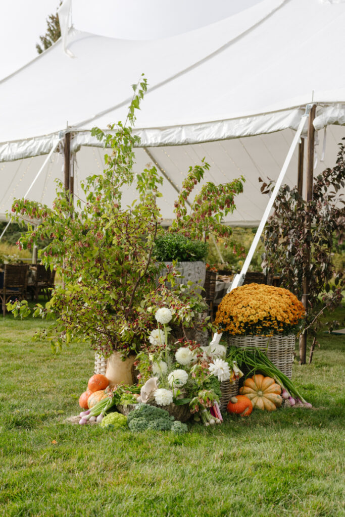 Elegant outdoor wedding weekend tent design in Jackson Hole with seasonal florals, greenery, and curated harvest-inspired details.