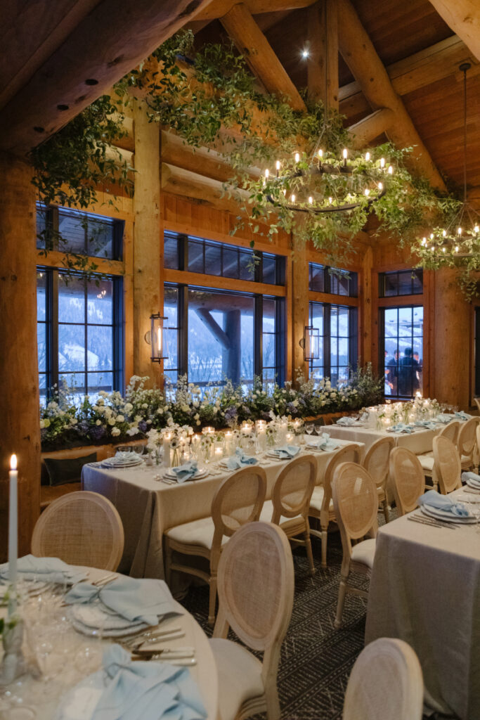 Romantic wedding reception in Jackson Hole with mountain views, candlelight, and timeless tablescape details.