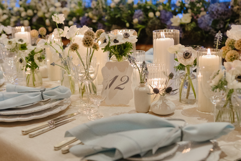 Elegant wedding weekend reception table design with candles, floral details, and refined place settings at a Jackson Hole wedding.