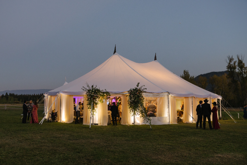 Luxury tented reception at Snake River Ranch surrounded by Wyoming landscapes
