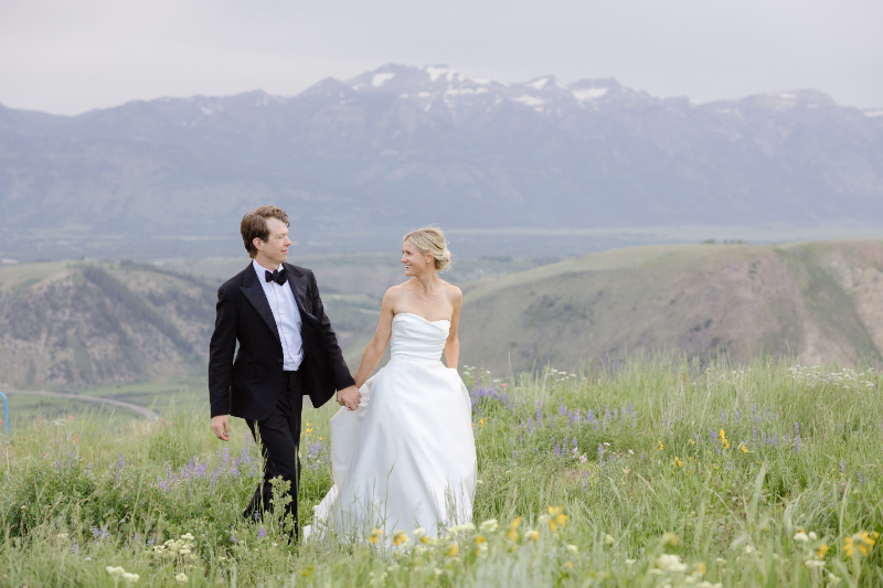 Jackson Hole wedding portraits with wildflowers and panoramic mountain views