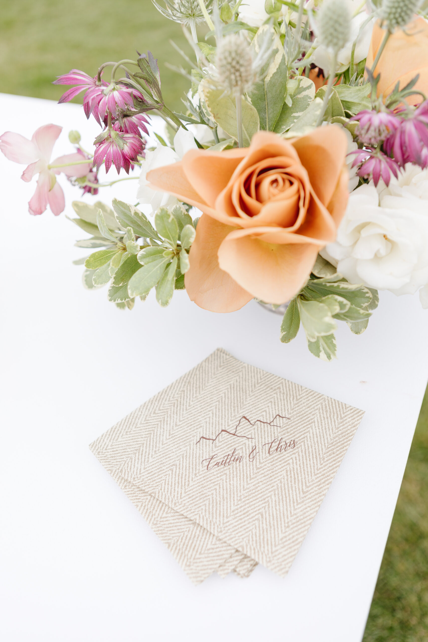 Fall wedding invitation suite with peach rose and seasonal floral arrangement in Jackson Hole
