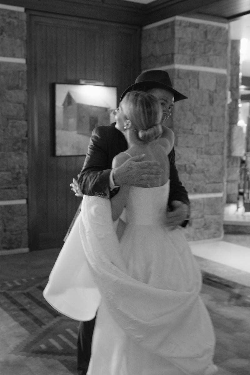 Black and white photo of bride and father's first look on the wedding day.
