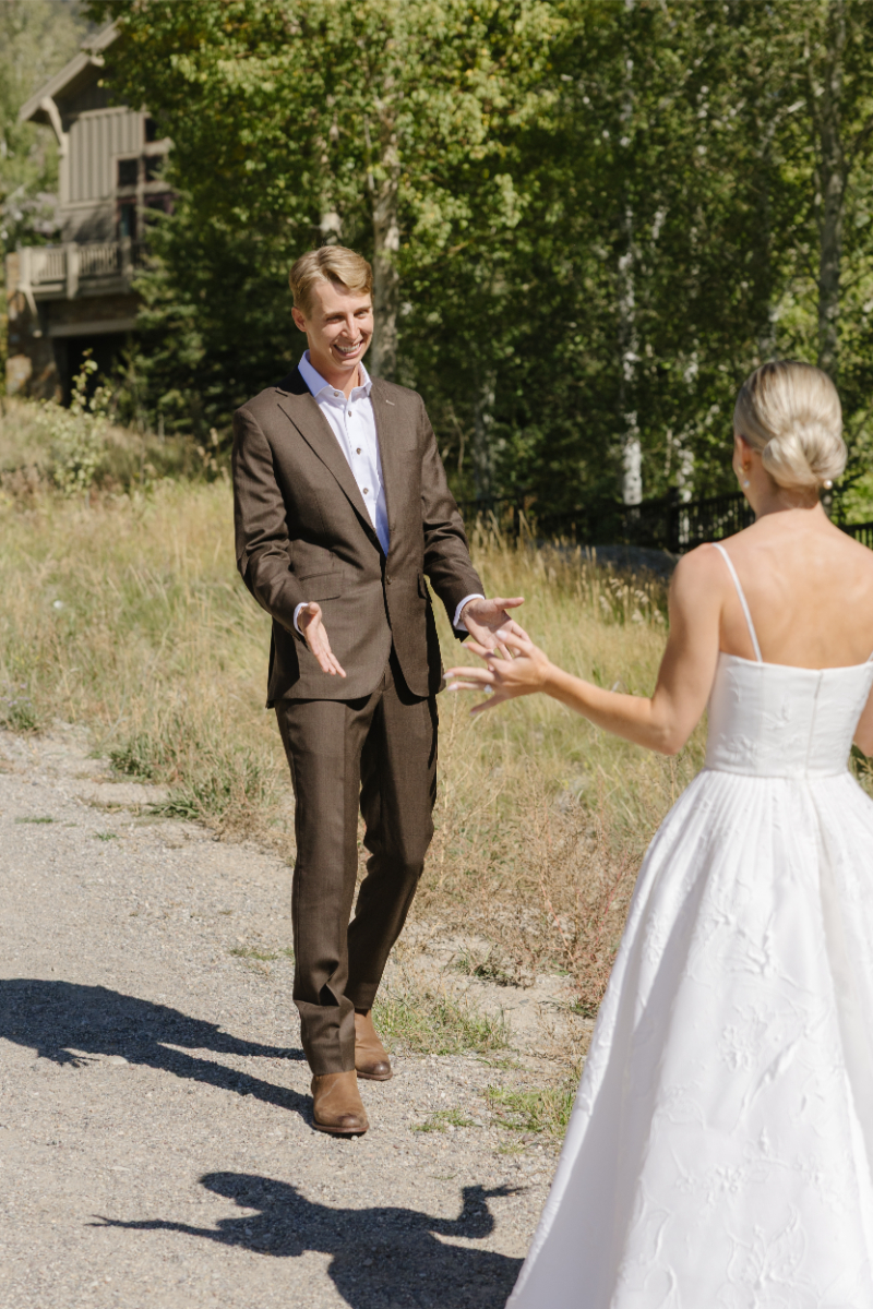 Groom turning around to face bride during their first look.