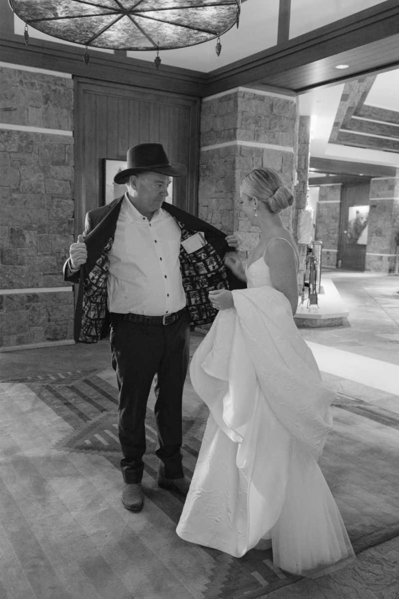 Black and white photo of bride and father's first look on the wedding day.