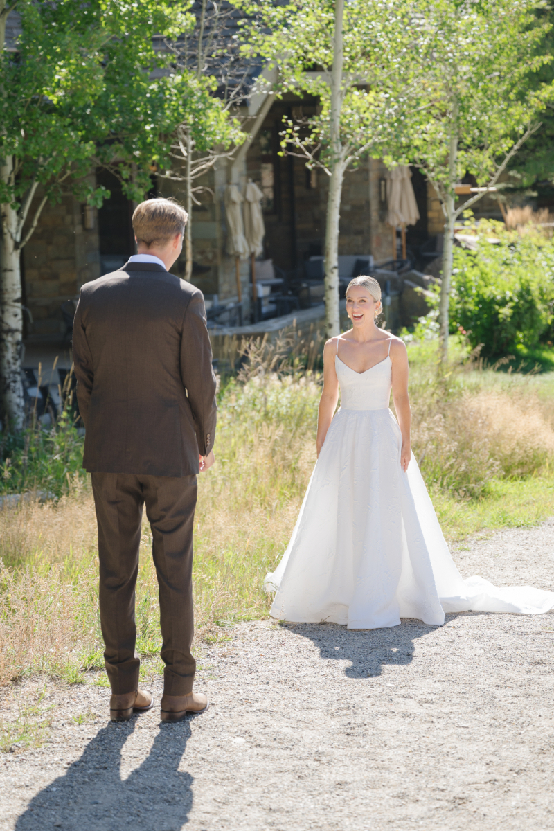 Bride's reaction to groom during their first look.