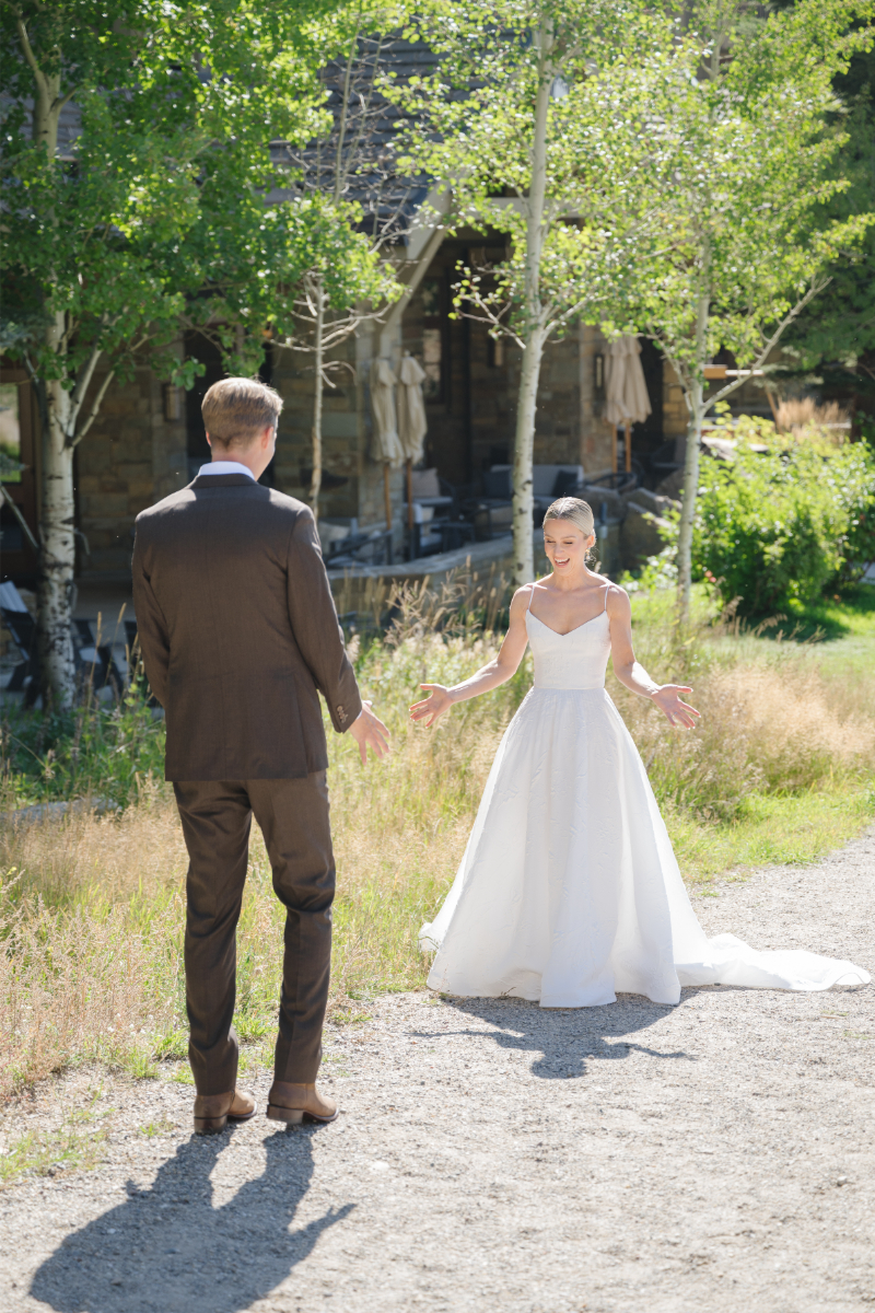 Bride's reaction to groom during their first look.