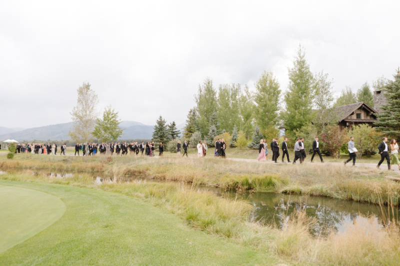 Wedding ceremony ideas featuring an elegant outdoor cocktail hour with floral details at a Jackson Hole wedding.