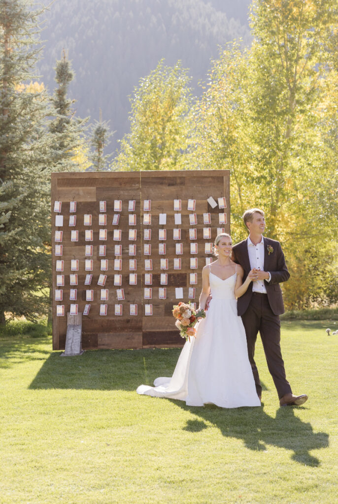 Bride and groom walking together during a fall Jackson Hole wedding
