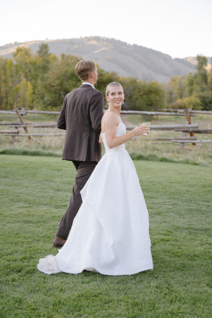 Bride and groom enjoying their Jackson Hole wedding reception outdoors