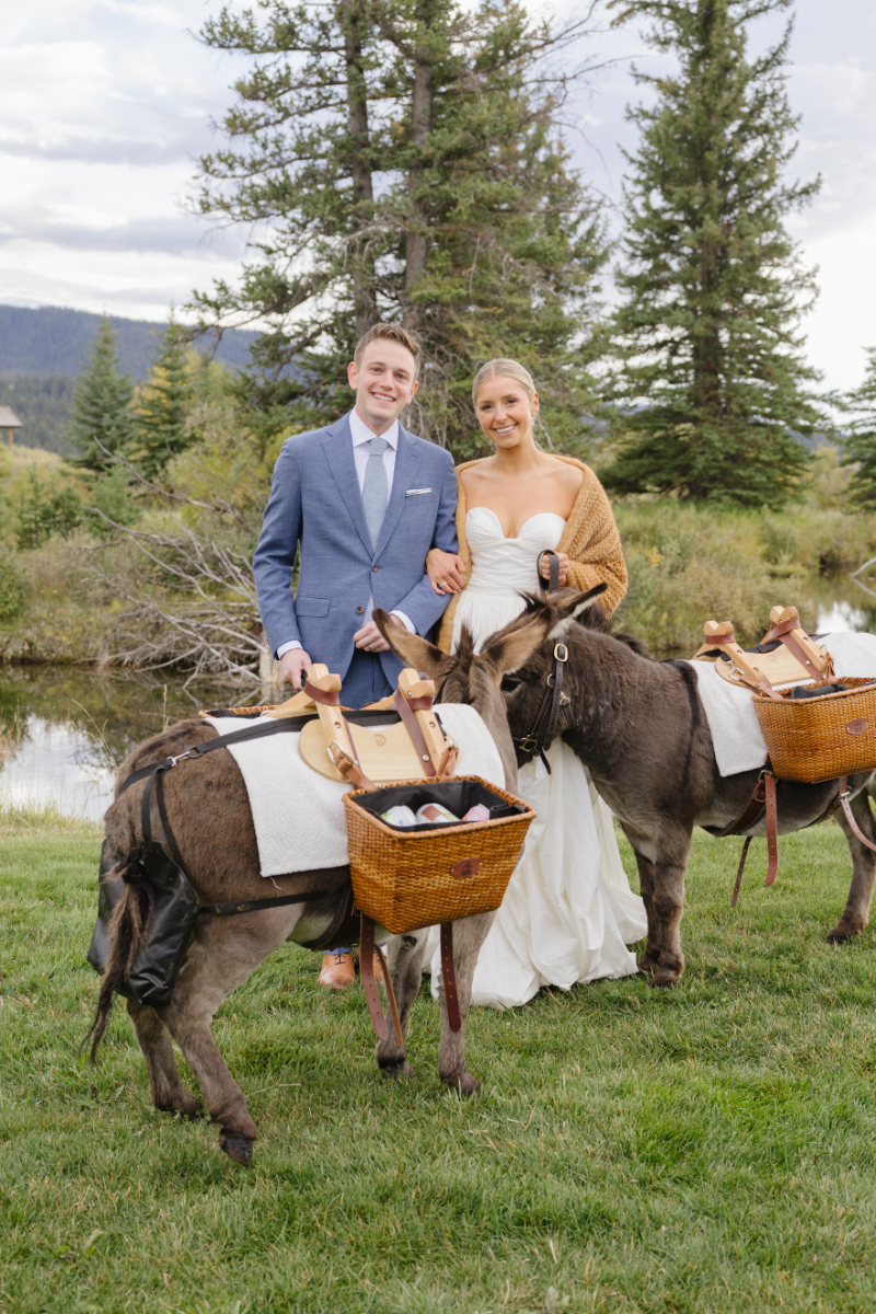 Bride and groom with donkeys during a Jackson Hole wedding celebration