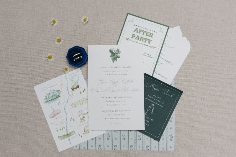 Jackson wedding invitation suite with illustrated map, after-party card, wedding details, and rings.