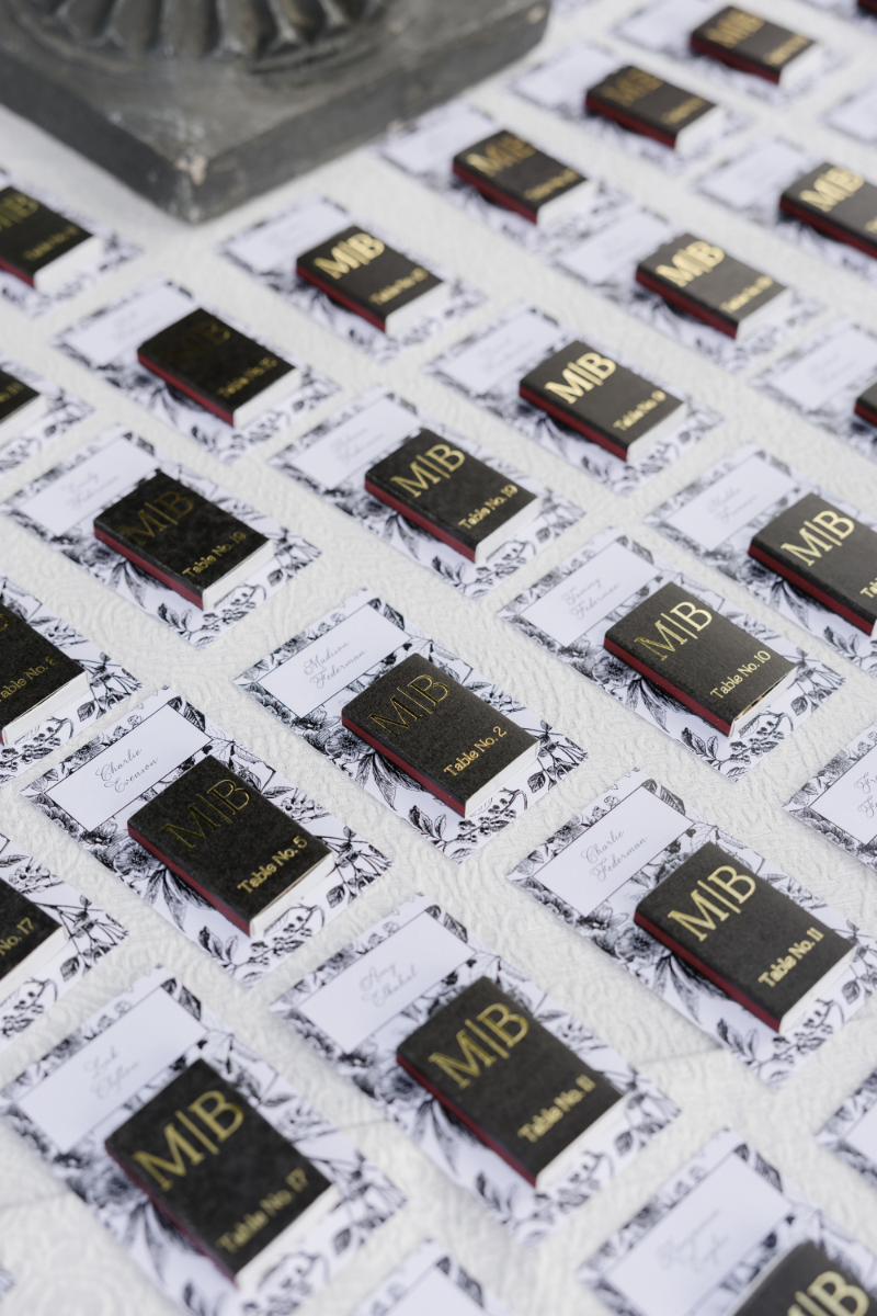 Personalized matchbox place cards displayed for guests at a Jackson Hole wedding reception